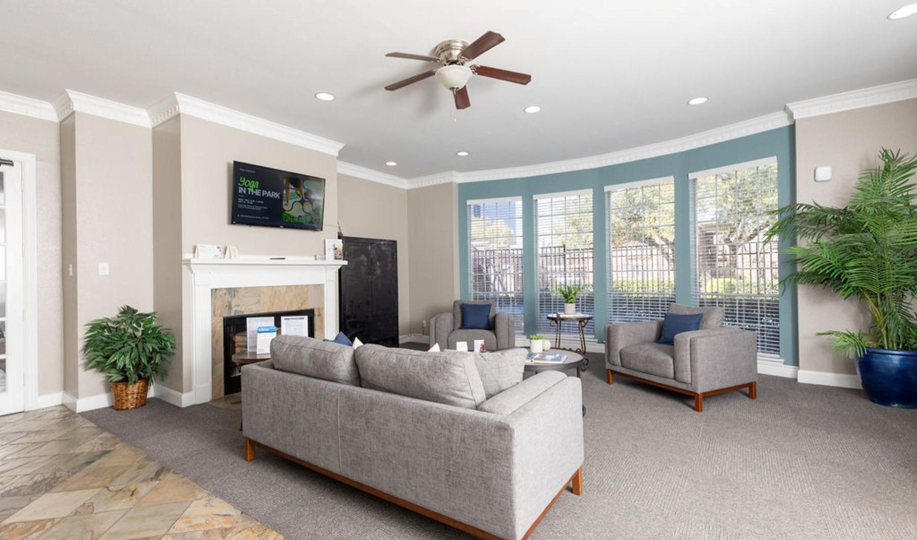 a living room with a fireplace and a tv