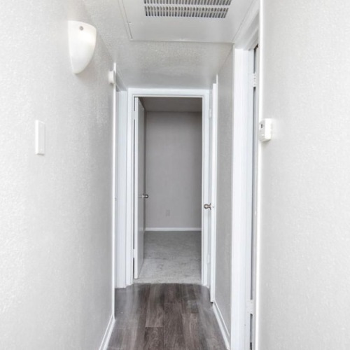 a hallway with a wood floor