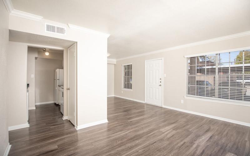 a room with white walls and a wood floor