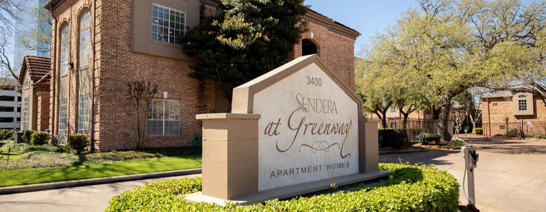 a sign in front of a building